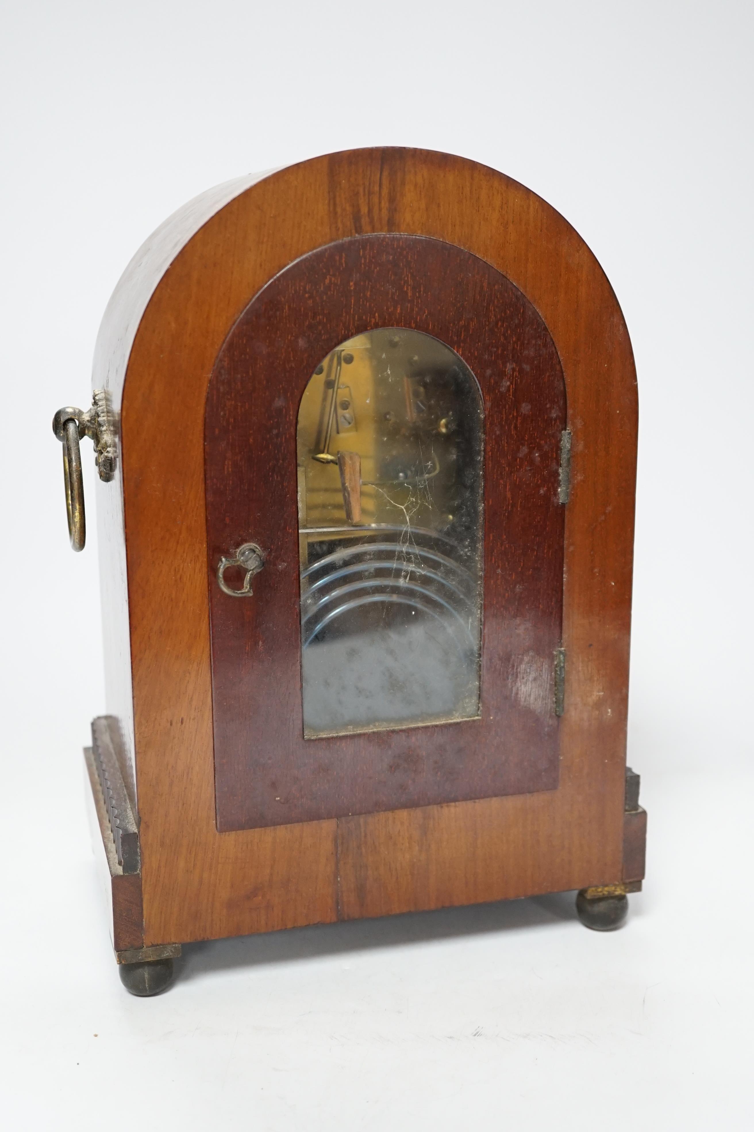 A late 19th century mahogany mantel clock with enamelled Roman numeral dial, 30cm high